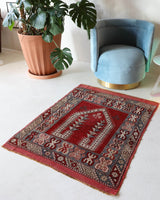 Small Turkish rug in a living room setting, pile rug, Turkish rug, vintage rug, portland, rug shop, bright colors, wild shaman, area rug, red rug, mini rug, bold color, Portland, Oregon, rug store, rug shop, local shop, flat weave, kilim rug