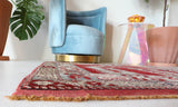 Small Turkish rug in a living room setting, pile rug, Turkish rug, vintage rug, portland, rug shop, bright colors, wild shaman, area rug, red rug, mini rug, bold color, Portland, Oregon, rug store, rug shop, local shop, flat weave, kilim rug
