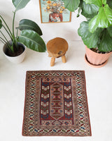 Vintage Turkish mini rug in room decor setting, old rug, antique rug, pastel colors, faded colors, Turkish rug, vintage rug, soft rug, Portland, Oregon, rug store, rug shop, local shop,  bright colors, bold colors