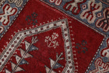 Small Turkish rug in a living room setting, pile rug, Turkish rug, vintage rug, portland, rug shop, bright colors, wild shaman, area rug, red rug, mini rug, bold color, Portland, Oregon, rug store, rug shop, local shop, flat weave, kilim rug