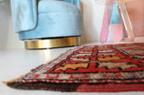 Small Turkish rug in a living room setting, pile rug, Turkish rug, vintage rug, portland, rug shop, bright colors, wild shaman, area rug, red rug, mini rug, bold color, Portland, Oregon, rug store, rug shop, local shop, flat weave, kilim rug