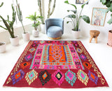 Vintage Turkish rug in a living room setting, pile rug, Turkish rug, vintage rug, portland, rug shop, bright colors, wild shaman, soft rug, bold color, Portland, Oregon, rug store, rug shop, local shop, antique rug