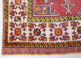 Small Turkish rug in a living room setting, pile rug, Turkish rug, vintage rug, portland, rug shop, bright colors, wild shaman, area rug, red rug, mini rug, bold color, Portland, Oregon, rug store, rug shop, local shop, flat weave, kilim rug