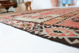 Vintage kilim rug in living room setting, old rug, antique rug, pastel colors, faded colors, Turkish rug, vintage rug, soft rug, Portland, Oregon, rug store, rug shop, local shop, earthy tones, earthy colors, warm colors
