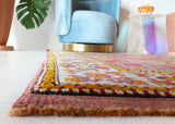 Small Turkish rug in a living room setting, pile rug, Turkish rug, vintage rug, portland, rug shop, bright colors, wild shaman, area rug, red rug, mini rug, bold color, Portland, Oregon, rug store, rug shop, local shop, flat weave, kilim rug