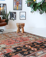 Vintage kilim rug in living room setting, old rug, antique rug, pastel colors, faded colors, Turkish rug, vintage rug, soft rug, Portland, Oregon, rug store, rug shop, local shop, earthy tones, earthy colors, warm colors