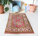 Small Turkish rug in a living room setting, pile rug, Turkish rug, vintage rug, portland, rug shop, bright colors, wild shaman, area rug, red rug, mini rug, bold color, Portland, Oregon, rug store, rug shop, local shop, flat weave, kilim rug