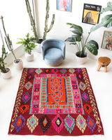 Vintage Turkish rug in a living room setting, pile rug, Turkish rug, vintage rug, portland, rug shop, bright colors, wild shaman, soft rug, bold color, Portland, Oregon, rug store, rug shop, local shop, antique rug