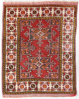 Small Turkish rug in a living room setting, pile rug, Turkish rug, vintage rug, portland, rug shop, bright colors, wild shaman, area rug, red rug, mini rug, bold color, Portland, Oregon, rug store, rug shop, local shop, flat weave, kilim rug