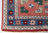 Small Turkish rug in a living room setting, pile rug, Turkish rug, vintage rug, portland, rug shop, bright colors, wild shaman, area rug, red rug, mini rug, bold color, Portland, Oregon, rug store, rug shop, local shop, flat weave, kilim rug