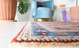 Small Turkish rug in a living room setting, pile rug, Turkish rug, vintage rug, portland, rug shop, bright colors, wild shaman, area rug, red rug, mini rug, bold color, Portland, Oregon, rug store, rug shop, local shop, flat weave, kilim rug