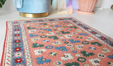 Small Turkish rug in a living room setting, pile rug, Turkish rug, vintage rug, portland, rug shop, bright colors, wild shaman, area rug, red rug, mini rug, bold color, Portland, Oregon, rug store, rug shop, local shop, flat weave, kilim rug