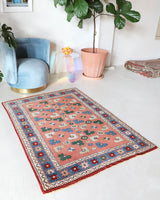 Small Turkish rug in a living room setting, pile rug, Turkish rug, vintage rug, portland, rug shop, bright colors, wild shaman, area rug, red rug, mini rug, bold color, Portland, Oregon, rug store, rug shop, local shop, flat weave, kilim rug