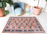 Small Turkish rug in a living room setting, pile rug, Turkish rug, vintage rug, portland, rug shop, bright colors, wild shaman, area rug, red rug, mini rug, bold color, Portland, Oregon, rug store, rug shop, local shop, flat weave, kilim rug