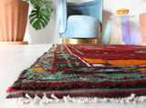 Small Turkish rug in a living room setting, pile rug, Turkish rug, vintage rug, portland, rug shop, bright colors, wild shaman, area rug, red rug, mini rug, bold color, Portland, Oregon, rug store, rug shop, local shop, flat weave, kilim rug