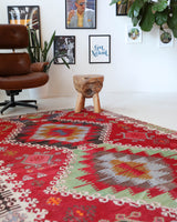 Vintage kilim rug in living room setting, bright colors, wild shaman, soft rug, bold color, Portland, Oregon, rug store, rug shop, local shop, vintage rug, modern kilim, warm colors
