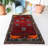 Small Turkish rug in a living room setting, pile rug, Turkish rug, vintage rug, portland, rug shop, bright colors, wild shaman, area rug, red rug, mini rug, bold color, Portland, Oregon, rug store, rug shop, local shop, flat weave, kilim rug