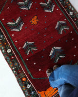 Small Turkish rug in a living room setting, pile rug, Turkish rug, vintage rug, portland, rug shop, bright colors, wild shaman, area rug, red rug, mini rug, bold color, Portland, Oregon, rug store, rug shop, local shop, flat weave, kilim rug