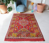 Small Turkish rug in a living room setting, pile rug, Turkish rug, vintage rug, portland, rug shop, bright colors, wild shaman, area rug, red rug, mini rug, bold color, Portland, Oregon, rug store, rug shop, local shop, flat weave, kilim rug