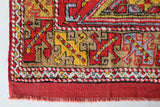 Small Turkish rug in a living room setting, pile rug, Turkish rug, vintage rug, portland, rug shop, bright colors, wild shaman, area rug, red rug, mini rug, bold color, Portland, Oregon, rug store, rug shop, local shop, flat weave, kilim rug