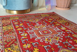 Small Turkish rug in a living room setting, pile rug, Turkish rug, vintage rug, portland, rug shop, bright colors, wild shaman, area rug, red rug, mini rug, bold color, Portland, Oregon, rug store, rug shop, local shop, flat weave, kilim rug