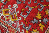 Small Turkish rug in a living room setting, pile rug, Turkish rug, vintage rug, portland, rug shop, bright colors, wild shaman, area rug, red rug, mini rug, bold color, Portland, Oregon, rug store, rug shop, local shop, flat weave, kilim rug