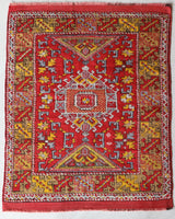 Small Turkish rug in a living room setting, pile rug, Turkish rug, vintage rug, portland, rug shop, bright colors, wild shaman, area rug, red rug, mini rug, bold color, Portland, Oregon, rug store, rug shop, local shop, flat weave, kilim rug