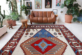 Vintage Turkish rug in a living room setting, Area rug in a living room setting, pile rug, Turkish rug, custom rug, , new rug, modern rug, customizable rug, made to order rug, portland, rug shop, bright colors, wild shaman, soft rug, bold color, Portland, Oregon, rug store, rug shop, local shop, made in Turkey