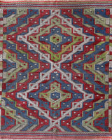 Vintage kilim rug in room decor setting, old rug, antique rug, pastel colors, faded colors, Turkish rug, vintage rug, soft rug, Portland, Oregon, rug store, rug shop, local shop,  antique kilim rug, bold colors, bright colors, faded colors