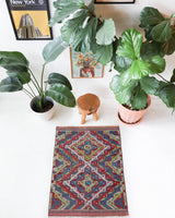 Vintage kilim rug in room decor setting, old rug, antique rug, pastel colors, faded colors, Turkish rug, vintage rug, soft rug, Portland, Oregon, rug store, rug shop, local shop,  antique kilim rug, bold colors, bright colors, faded colors