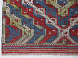 Vintage kilim rug in room decor setting, old rug, antique rug, pastel colors, faded colors, Turkish rug, vintage rug, soft rug, Portland, Oregon, rug store, rug shop, local shop,  antique kilim rug, bold colors, bright colors, faded colors