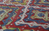Vintage kilim rug in room decor setting, old rug, antique rug, pastel colors, faded colors, Turkish rug, vintage rug, soft rug, Portland, Oregon, rug store, rug shop, local shop,  antique kilim rug, bold colors, bright colors, faded colors