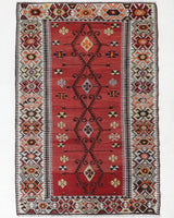 Vintage kilim rug in room decor setting, old rug, antique rug, pastel colors, faded colors, Turkish rug, vintage rug, soft rug, Portland, Oregon, rug store, rug shop, local shop, antique kilim rug, bold colors, bright colors, faded colors