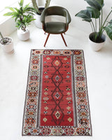 Vintage kilim rug in room decor setting, old rug, antique rug, pastel colors, faded colors, Turkish rug, vintage rug, soft rug, Portland, Oregon, rug store, rug shop, local shop, antique kilim rug, bold colors, bright colors, faded colors