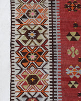 Vintage kilim rug in room decor setting, old rug, antique rug, pastel colors, faded colors, Turkish rug, vintage rug, soft rug, Portland, Oregon, rug store, rug shop, local shop, antique kilim rug, bold colors, bright colors, faded colors