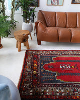 Vintage Turkish rug in a living room setting, pile rug, Turkish rug, vintage rug, portland, rug shop, bright colors, wild shaman, soft rug, bold color, Portland, Oregon, rug store, rug shop, local shop, antique rug
