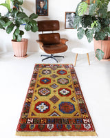 Vintage Turkish runner rug in a living room setting, pile rug, Turkish rug, vintage rug, portland, rug shop, bright colors, wild shaman, soft rug, bold color, Portland, Oregon, rug store, rug shop, local shop, antique rug