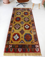 Vintage Turkish runner rug in a living room setting, pile rug, Turkish rug, vintage rug, portland, rug shop, bright colors, wild shaman, soft rug, bold color, Portland, Oregon, rug store, rug shop, local shop, antique rug