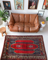 Vintage Turkish rug in a living room setting, pile rug, Turkish rug, vintage rug, portland, rug shop, bright colors, wild shaman, soft rug, bold color, Portland, Oregon, rug store, rug shop, local shop, antique rug