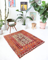 Vintage kilim rug in living room setting, old rug, antique rug, pastel colors, faded colors, Turkish rug, vintage rug, soft rug, Portland, Oregon, rug store, rug shop, local shop, earthy tones, earthy colors, warm colors