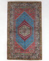 Vintage Turkish rug in living room setting, old rug, antique rug, pastel colors, faded colors, Turkish rug, vintage rug, soft rug, Portland, Oregon, rug store, rug shop, local shop