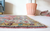 Vintage Turkish rug in living room setting, old rug, antique rug, pastel colors, faded colors, Turkish rug, vintage rug, soft rug, Portland, Oregon, rug store, rug shop, local shop