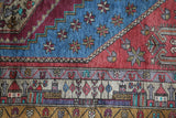 Vintage Turkish rug in living room setting, old rug, antique rug, pastel colors, faded colors, Turkish rug, vintage rug, soft rug, Portland, Oregon, rug store, rug shop, local shop
