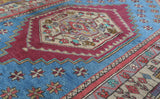 Vintage Turkish rug in living room setting, old rug, antique rug, pastel colors, faded colors, Turkish rug, vintage rug, soft rug, Portland, Oregon, rug store, rug shop, local shop