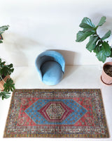 Vintage Turkish rug in living room setting, old rug, antique rug, pastel colors, faded colors, Turkish rug, vintage rug, soft rug, Portland, Oregon, rug store, rug shop, local shop