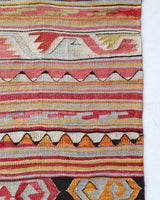 Vintage kilim rug in living room setting, old rug, antique rug, pastel colors, faded colors, Turkish rug, vintage rug, soft rug, Portland, Oregon, rug store, rug shop, local shop, earthy tones, earthy colors, warm colors