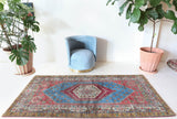 Vintage Turkish rug in living room setting, old rug, antique rug, pastel colors, faded colors, Turkish rug, vintage rug, soft rug, Portland, Oregon, rug store, rug shop, local shop