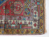 Vintage Turkish rug in living room setting, old rug, antique rug, pastel colors, faded colors, Turkish rug, vintage rug, soft rug, Portland, Oregon, rug store, rug shop, local shop