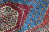 Vintage Turkish rug in living room setting, old rug, antique rug, pastel colors, faded colors, Turkish rug, vintage rug, soft rug, Portland, Oregon, rug store, rug shop, local shop