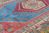 Vintage Turkish rug in living room setting, old rug, antique rug, pastel colors, faded colors, Turkish rug, vintage rug, soft rug, Portland, Oregon, rug store, rug shop, local shop